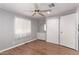 Bedroom with wood floors, ceiling fan, dresser and closet at 2650 W Union Hills Dr # 352, Phoenix, AZ 85027