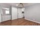 Bedroom with wood floors, ceiling fan and laundry access at 2650 W Union Hills Dr # 352, Phoenix, AZ 85027
