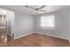Bright bedroom with wood floors, ceiling fan, and window coverings at 2650 W Union Hills Dr # 352, Phoenix, AZ 85027
