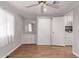 Bedroom with wood floors, built-in dresser, and laundry access at 2650 W Union Hills Dr # 352, Phoenix, AZ 85027