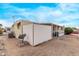 View of the mobile home's exterior, showing the shed and satellite dish at 2650 W Union Hills Dr # 352, Phoenix, AZ 85027