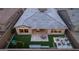 Aerial view of the backyard with a covered patio, artificial turf, water feature, and firepit seating area at 32722 N 132Nd Ln, Peoria, AZ 85383