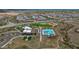 Community with recreation center featuring pool, sports field, and play area, surrounded by homes at 32722 N 132Nd Ln, Peoria, AZ 85383