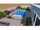 Backyard oasis featuring modern pool, a water feature, desert landscaping and fire pit at 32722 N 132Nd Ln, Peoria, AZ 85383