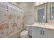 Bright bathroom features white vanity, tile flooring and a shower/tub combo at 32722 N 132Nd Ln, Peoria, AZ 85383