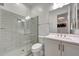 Bathroom showcasing a glass-enclosed shower, toilet, vanity, and a stylish mirror at 32722 N 132Nd Ln, Peoria, AZ 85383