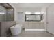 Bright bathroom featuring a modern tub, double vanity, and a glass-enclosed shower at 32722 N 132Nd Ln, Peoria, AZ 85383