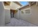 Entrance featuring custom paver flooring and a custom iron gate with a window looking into the home at 32722 N 132Nd Ln, Peoria, AZ 85383