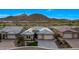 Beautiful house with well-maintained landscaping, a driveway, and a three-car garage in a desirable neighborhood at 32722 N 132Nd Ln, Peoria, AZ 85383