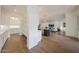 Bright, open living space flows seamlessly between kitchen, dining, and living areas, perfect for entertaining at 32722 N 132Nd Ln, Peoria, AZ 85383