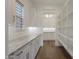 Well-organized pantry with shelving, ample storage, and granite countertops providing optimal functionality at 32722 N 132Nd Ln, Peoria, AZ 85383
