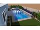 Backyard pool with with built in water feature, in-pool seating and a luxurious, modern aesthetic at 32722 N 132Nd Ln, Peoria, AZ 85383