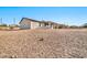 View of home's back and expansive desert lot at 3433 W Wander Rd, New River, AZ 85087