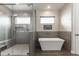 Modern bathroom with a soaking tub and walk-in shower at 34949 N Donald Way, San Tan Valley, AZ 85140