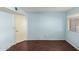 Simple bedroom with wood flooring and a window at 3644 W Saint John Rd, Glendale, AZ 85308