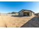 Desert backyard with home and patio visible at 40108 W Crane Dr, Maricopa, AZ 85138