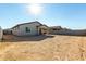 Sunny backyard, view of home and neighbor homes at 40108 W Crane Dr, Maricopa, AZ 85138