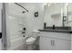 Bathroom with tub, toilet and modern vanity at 40108 W Crane Dr, Maricopa, AZ 85138