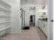 Bathroom boasts double vanity, walk-in shower, and linen shelves at 40108 W Crane Dr, Maricopa, AZ 85138