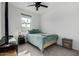 Bright bedroom with a double bed, window, and ceiling fan at 40108 W Crane Dr, Maricopa, AZ 85138