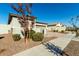 Side view of a house with attractive landscaping and neutral color scheme at 40108 W Crane Dr, Maricopa, AZ 85138