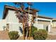 Landscaped home exterior with a two-car garage and desert landscaping at 40108 W Crane Dr, Maricopa, AZ 85138