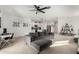 Open-concept living space with gray sectional sofa and modern decor at 40108 W Crane Dr, Maricopa, AZ 85138