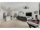 Open concept living area with kitchen and island visible in the background at 40108 W Crane Dr, Maricopa, AZ 85138