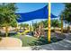 Modern playground with a shaded play area at 40108 W Crane Dr, Maricopa, AZ 85138