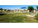 Community playground with play structures and shaded areas at 40108 W Crane Dr, Maricopa, AZ 85138
