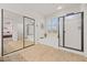 Bathroom with soaking tub, walk-in shower, and mirrored closet at 40208 N Faith Ln, Anthem, AZ 85086