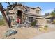 Two-story home with red door and landscaping at 40208 N Faith Ln, Anthem, AZ 85086