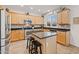 Kitchen with island, stainless steel appliances, and light wood cabinets at 40208 N Faith Ln, Anthem, AZ 85086