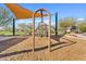 Modern playground with swings and climbing structures at 4127 W Granite Basin Dr, New River, AZ 85087