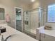 Bathroom with double vanity, walk-in shower, and soaking tub at 42127 N Celebration Way, Anthem, AZ 85086