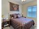 Charming bedroom with a double bed and wall art at 42127 N Celebration Way, Anthem, AZ 85086