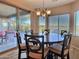 Bright dining room with a table for six and views of the backyard at 42127 N Celebration Way, Anthem, AZ 85086