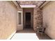Inviting entryway with a dark wood door and stone accent wall at 42127 N Celebration Way, Anthem, AZ 85086