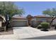 Two-car garage and welcoming entryway at 42127 N Celebration Way, Anthem, AZ 85086