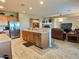 Open kitchen with island and stainless steel appliances at 42127 N Celebration Way, Anthem, AZ 85086