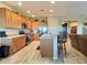 Open kitchen with island and stainless steel appliances at 42127 N Celebration Way, Anthem, AZ 85086