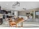 Open concept dining area with wooden table and view of the living room and kitchen at 4712 S Onyx Dr, Chandler, AZ 85249