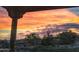 Sunset view from covered patio, showcasing desert landscape at 48412 N 31St Ave, New River, AZ 85087