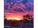 Vibrant sunset over desert landscape with cacti at 48412 N 31St Ave, New River, AZ 85087