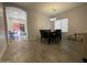 Dining area with a dark wood table and four chairs at 5128 S 6Th St, Phoenix, AZ 85040