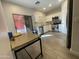 Modern kitchen with white cabinets and stainless steel appliances at 5128 S 6Th St, Phoenix, AZ 85040