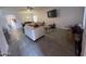 Bright living room with gray tile floors and a large TV at 5128 S 6Th St, Phoenix, AZ 85040