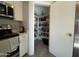 Well-organized pantry with ample shelving at 5128 S 6Th St, Phoenix, AZ 85040