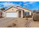 Cute single story home with a white garage door and landscaped yard at 5144 E Colby St, Mesa, AZ 85205