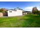 Home's side yard showcasing a grassy lawn at 615 E Winter Dr, Phoenix, AZ 85020